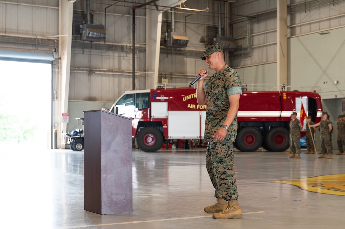 U.S. Marine Corps Lt. Col. David Rubio, Marine Corps Detachment Goodfellow commanding officer, addresses the crowd during a change of command ceremony at the Louis F. Garland Department of War Fire Academy, Goodfellow Air Force Base, Texas, June 12, 2026. The mission of MCD Goodfellow is to provide administrative, logistical and comprehensive training support to staff and students in the occupational fields of signals intelligence and expeditionary firefighting and rescue in order to deliver technically proficient, combat-capable Marines to the operating force and supporting establishment. (U.S. Air Force photo by Senior Airman Brian Lummus)