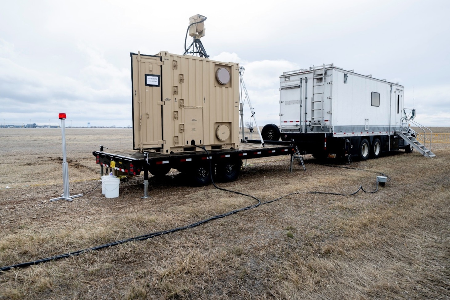 Boeing's laser system intended for dual-use in power beaming and aerial defense sits in the field for testing. The U.S. Naval Research Laboratory works with Boeing and the U.S. Army in testing the capability of a dual-use laser systems. (U.S. Navy photo by Jonathan Steffen-Arnold)