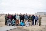 U.S. Naval Research Laboratory (NRL) partners and observers gather for a group photo while testing a dual-use in power beaming and aerial defense systems. NRL continues to work with Boeing and the U.S. Army to test the capability of a dual-use laser system. (U.S. Navy photo by Jonathan Steffen-Arnold)