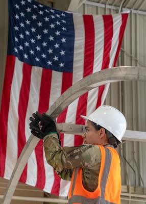 Army Sgt. Alondra Lopez, assigned to DLA Disposition Services Unit 2, in Anniston, Alabama, assembles an Alaska Small Shelter as part of the Joint Contingency Operational Readiness Training held in Battle Creek, Michigan.