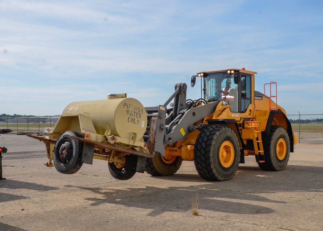 Courtney Aubrey, an equipment specialist stationed at DLA Disposition Services at Red River Army Depot, Texas operates 25k Front end loader to reposition a water buffalo during the Joint Contingency Operational Readiness Training held in Battle Creek, Michigan.