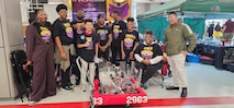Students from the Anacostia High School Robotics team, the "AnaDroids," participated in a FIRST Robotics Competition in Severn, Maryland, supported by PAE SSP's Ishmael Kamara.