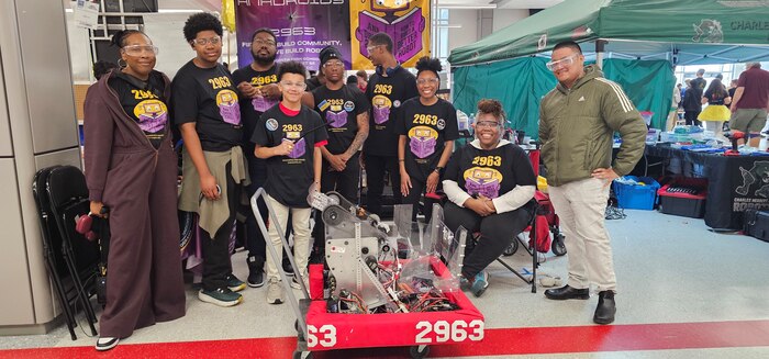 Students from the Anacostia High School Robotics team, the "AnaDroids," participated in a FIRST Robotics Competition in Severn, Maryland, supported by PAE SSP's Ishmael Kamara.