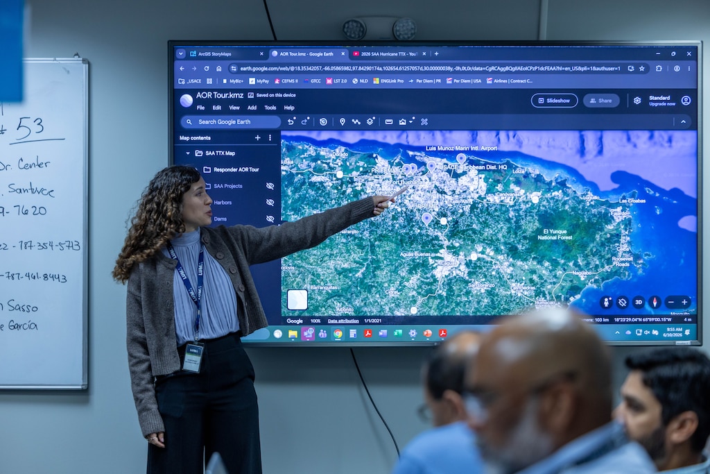 Patricia Fontanet Rodríguez, chief of Emergency Management for the Caribbean District, points out the path of a fictional hurricane during the Caribbean District’s 2026 Hurricane Tabletop Exercise in San Juan, Puerto Rico, June 9–10. Participants coordinated actions for a simulated Category 3 storm. The exercise demonstrated how USACE districts can rapidly surge personnel and expertise to support FEMA and local agencies during major disasters.