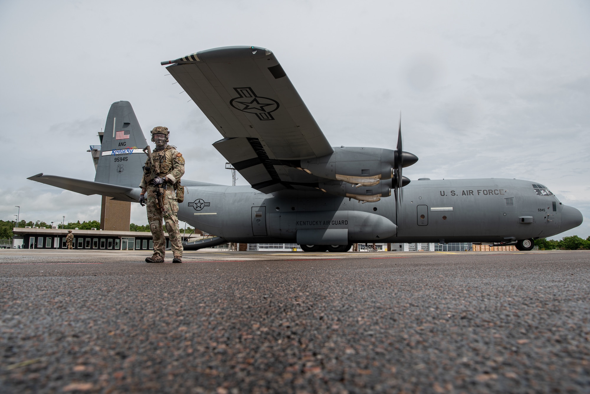Members of the Danish Armed Forces provide perimeter security for a U.S. Air Force C-130J Super Hercules aircraft assigned to the 123rd Airlift Wing, Kentucky Air National Guard, during a search-and-recovery training scenario at Bornholm Airport near Rønne, Denmark, June 9, 2026. The 123rd AW is providing tactical airlift to NATO Allies throughout the month of June in support of Ramstein Flag 2026, an Allied Air Command large-scale, multi-location and joint operating area exercise with 18 participating nations and more than 200 aircraft. (U.S. Air National Guard photo by Master Sgt. Joshua Horton)