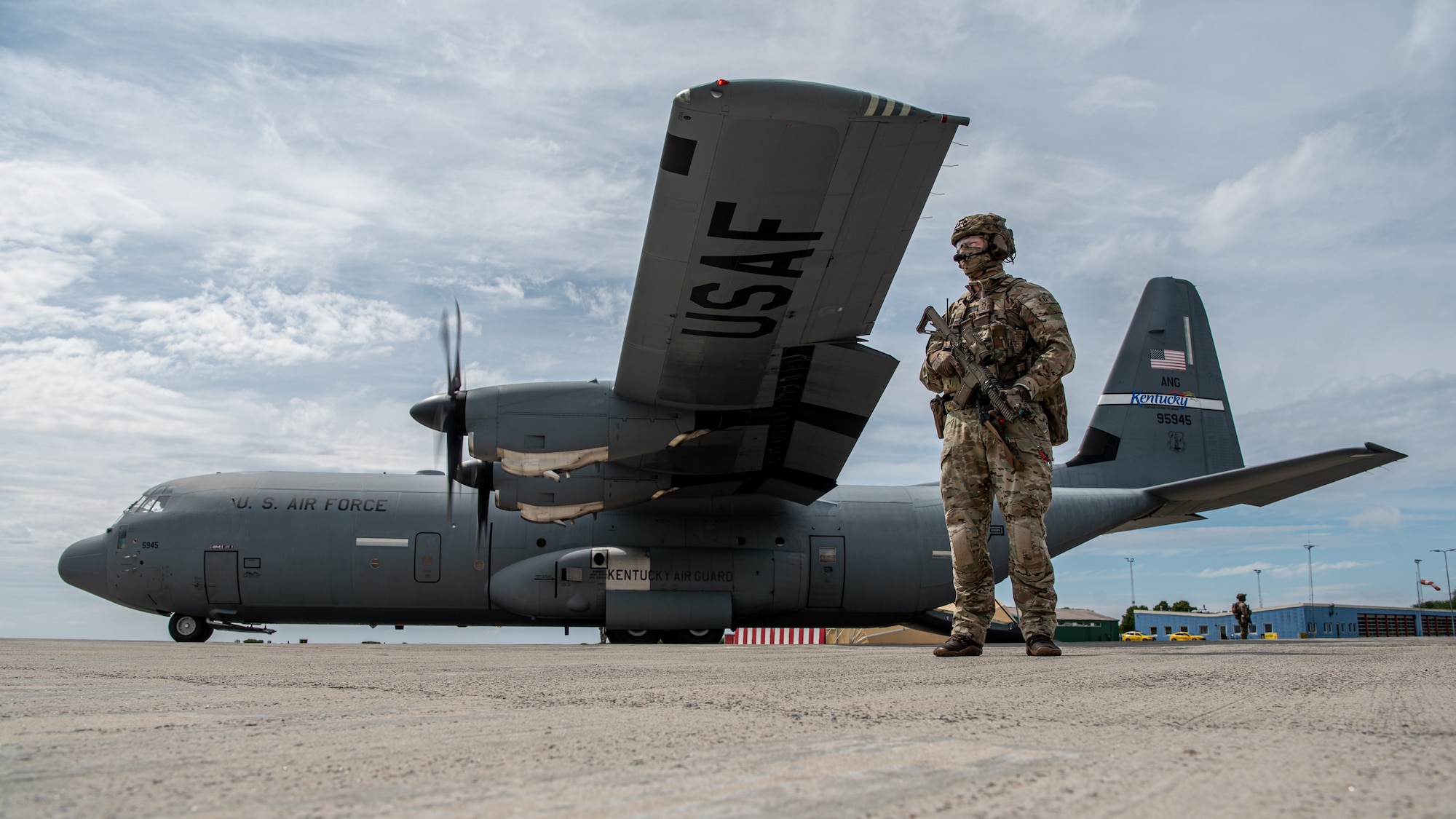 Members of the Danish Armed Forces provide perimeter security for a U.S. Air Force C-130J Super Hercules aircraft assigned to the 123rd Airlift Wing, Kentucky Air National Guard, during a search-and-recovery training scenario at Bornholm Airport near Rønne, Denmark, June 9, 2026. The 123rd AW is providing tactical airlift to NATO Allies throughout the month of June in support of Ramstein Flag 2026, an Allied Air Command large-scale, air-focused, multi-location and joint operating area exercise that kicks off June 8 with 18 participating nations and more than 200 aircraft. (U.S. Air National Guard photo by Master Sgt. Joshua Horton)