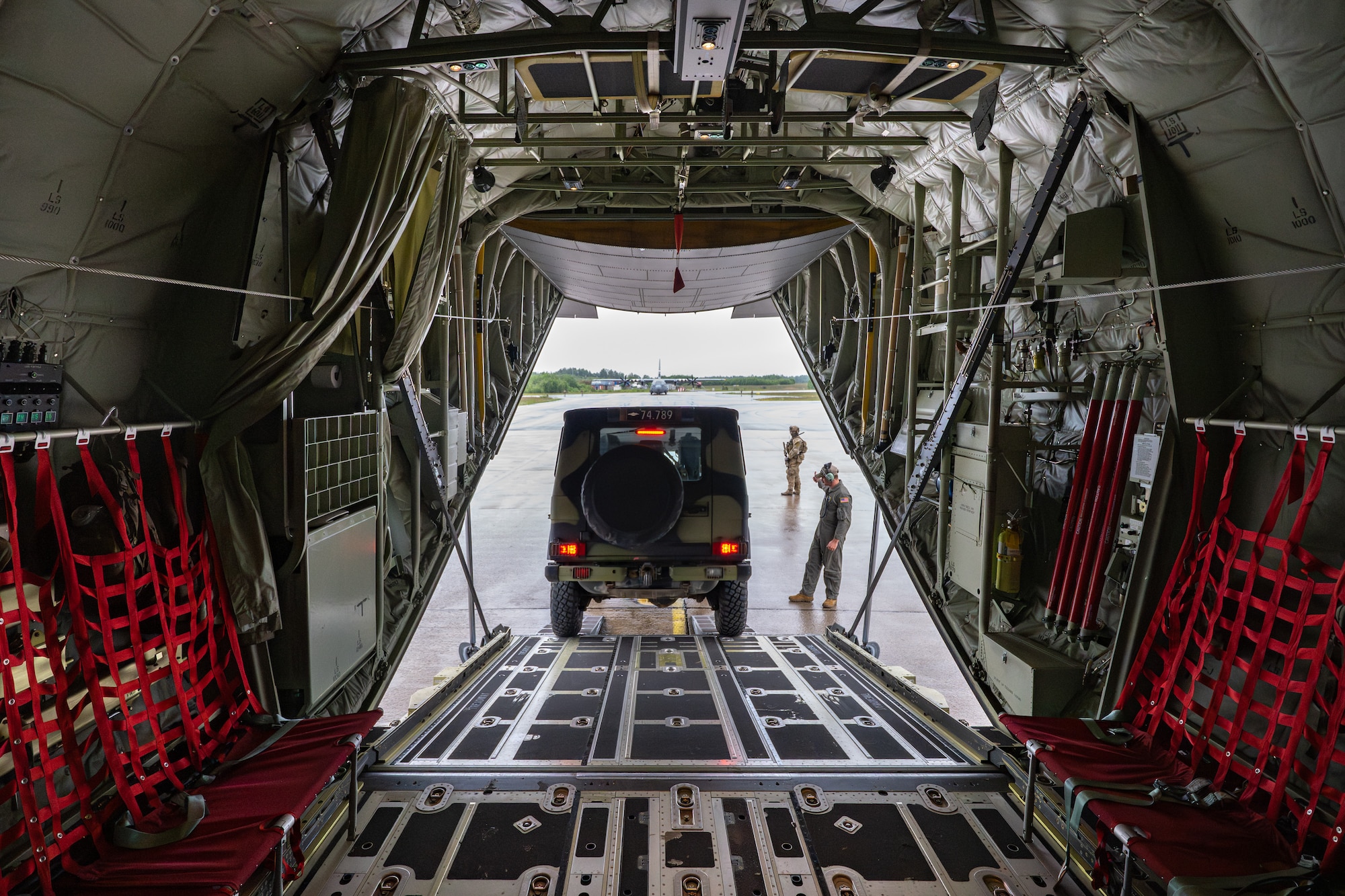 A U.S. Air Force loadmaster with the 123rd Airlift Wing, Kentucky Air National Guard, guides a Danish Armed Forces Air Mobile Protection and Recovery team vehicle off a C-130J Super Hercules aircraft at Rygge Air Station, Norway, June 9, 2026, during a search-and-recovery training scenario. The 123rd AW is providing tactical airlift to NATO Allies throughout the month of June in support of Ramstein Flag 2026, an Allied Air Command large-scale, multi-location and joint operating area exercise with 18 participating nations and more than 200 aircraft. (U.S. Air National Guard photo by Lt. Col. Dale Greer)
