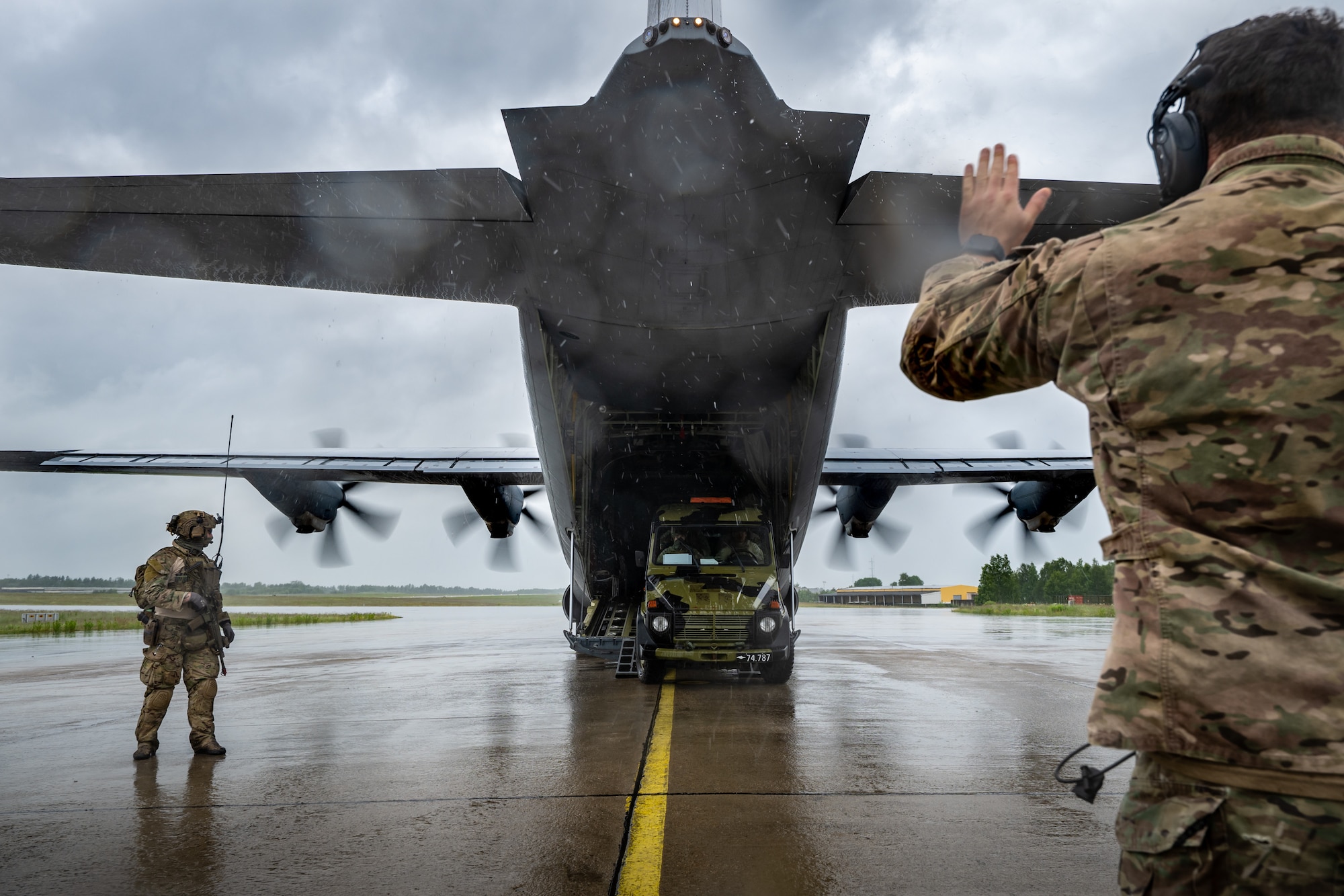A U.S. Air Force loadmaster with the 123rd Airlift Wing, Kentucky Air National Guard, guides a Danish Armed Forces Air Mobile Protection and Recovery team vehicle onto a C-130J Super Hercules aircraft at Rygge Air Station, Norway, June 9, 2026, during a search-and-recovery training scenario. The 123rd AW is providing tactical airlift to NATO Allies throughout the month of June in support of Ramstein Flag 2026, an Allied Air Command large-scale, multi-location and joint operating area exercise with 18 participating nations and more than 200 aircraft. (U.S. Air National Guard photo by Lt. Col. Dale Greer)