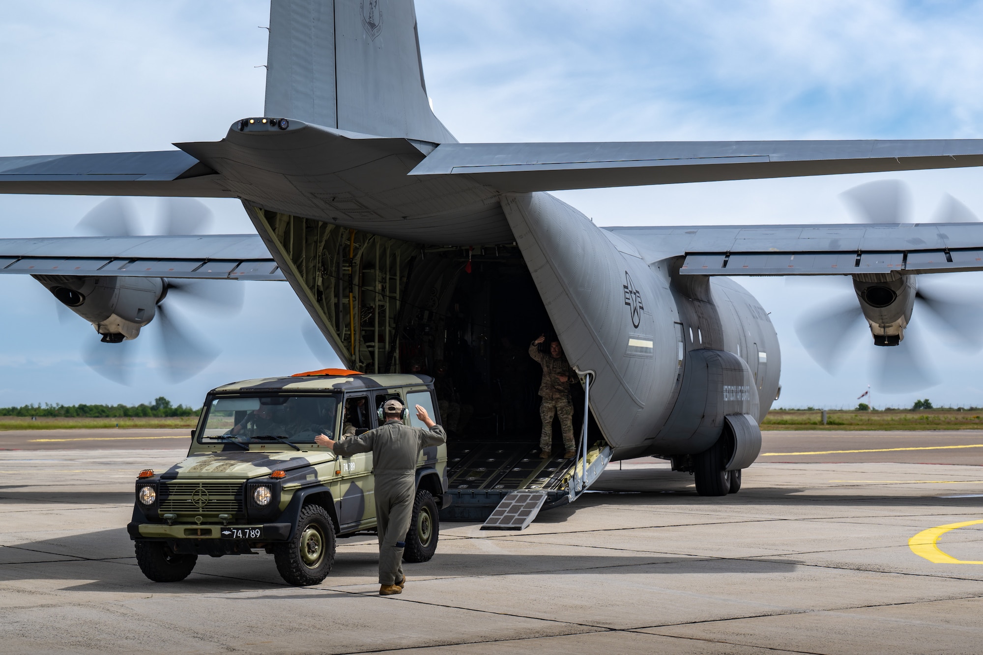 U.S. Air Force loadmasters assigned to the 123rd Airlift Wing, Kentucky Air National Guard, guide a Danish Armed Forces Air Mobile Protection and Recovery team vehicle onto a C-130J Super Hercules aircraft at Bornholm Airport near Rønne, Denmark, June 9, 2026, during a search-and-recovery training scenario. The 123rd AW is providing tactical airlift to NATO Allies throughout the month of June in support of Ramstein Flag 2026, an Allied Air Command large-scale, multi-location and joint operating area exercise with 18 participating nations and more than 200 aircraft. (U.S. Air National Guard photo by Lt. Col. Dale Greer)