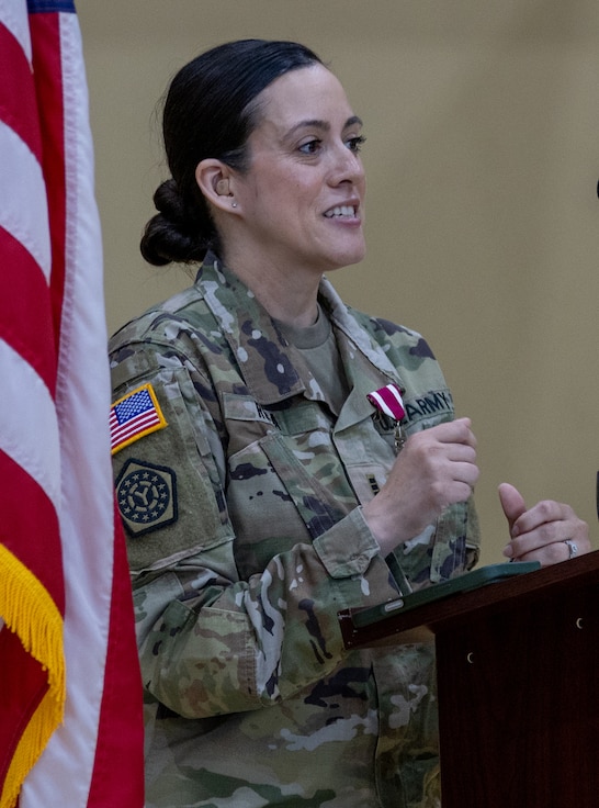Chief Warrant Officer 3 Jennifer Rosa, the 33rd Infantry Brigade Combat Team’s Human Resources technician, thanks family, friends, and fellow Soldiers for their support throughout her 25 years of service with the Illinois Army National Guard during a retirement ceremony June 5 at the brigade headquarters in Urbana.