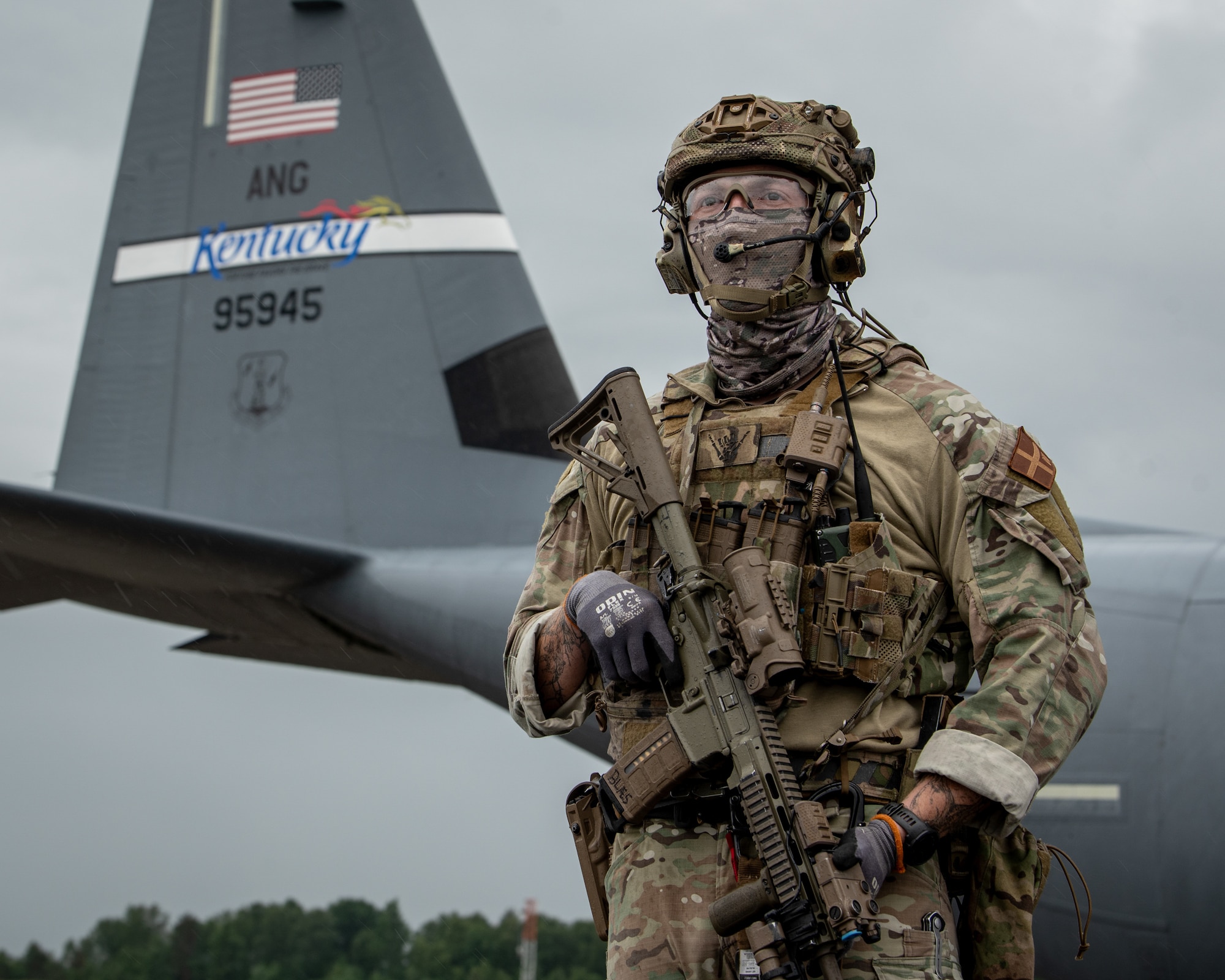 A member of the Danish Armed Forces provides perimeter security for a U.S. Air Force C-130J Super Hercules aircraft assigned to the 123rd Airlift Wing, Kentucky Air National Guard, during a search-and-recovery training scenario at Bornholm Airport near Rønne, Denmark, June 9, 2026. The 123rd AW is providing tactical airlift to NATO Allies throughout the month of June in support of Ramstein Flag 2026, an Allied Air Command large-scale, multi-location and joint operating area exercise with 18 participating nations and more than 200 aircraft. (U.S. Air National Guard photo by Master Sgt. Joshua Horton)