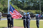 Youth Challenge Academy cadets lower the American flag during a ceremony event Sep. 19, 2025 in Fort Stewart, Ga.