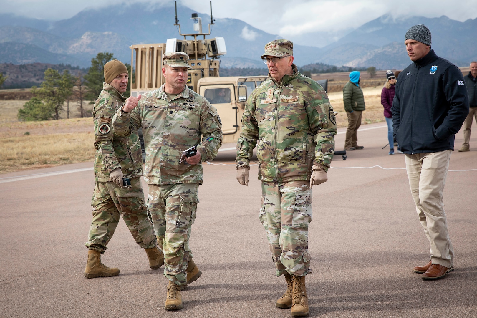 U.S. military service men walk on a military base.