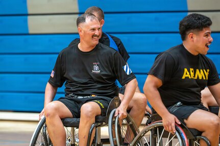 U.S. Army Capt. Allan Hartung smiles as he prepares for wheelchair basketball training at the 2026 Warrior Games Training Camp in San Antonio, Texas, June 10, 2026.