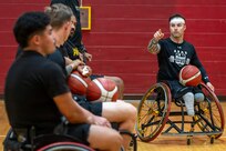 Retired U.S. Army Spc. JP Lane, a former Warrior Games Team Army competitor, provides instruction during wheelchair basketball training at the 2026 Warrior Games Training Camp in San Antonio, Texas, June 10, 2026.