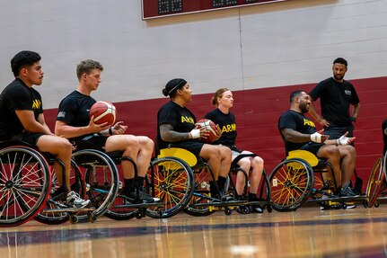 Team Army competitors receive instruction during wheelchair basketball training at the 2026 Warrior Games Training Camp in San Antonio, Texas, June 10, 2026.