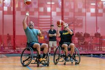 Retired U.S. Army Chief Warrant Officer Bruce McCormick (left) and U.S. Army Master Sgt. Aaron Frederick (right) participate in a wheelchair basketball drill during the 2026 Warrior Games Training Camp in San Antonio, Texas, June 10, 2026.