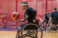 Retired U.S. Army Spc. JP Lane, a former Warrior Games Team Army competitor, participates in a wheelchair basketball drill during the 2026 Warrior Games training camp in San Antonio, Texas, June 10, 2026.