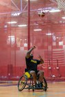 U.S. Army Staff Sgt. Daniel Agosto takes a shot during wheelchair basketball training at the 2026 Warrior Games Training Camp in San Antonio, Texas, June 10, 2026.