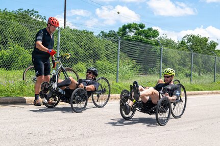 U.S. Army Staff Sgt. Paul Zimmerman (left) and Chief Warrant Officer 3 Cody Edgerton (right) participate in a handcycling training session in preparation for the 2026 Warrior Games, June 10, 2026.