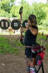 Retired Sgt. 1st Class Valerie Watkins aims her arrow during an archery practice session at an archery range on Joint Base San Antonio-Fort Sam Houston, Texas, June 10, 2026.