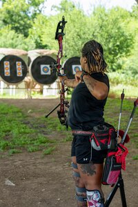 Retired Sgt. 1st Class Valerie Watkins aims her arrow during an archery practice session at an archery range on Joint Base San Antonio-Fort Sam Houston, Texas, June 10, 2026.