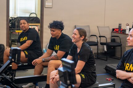 Team Army competitors listen to instruction during indoor rowing training at the 2026 Warrior Games training camp in San Antonio, Texas, June 10, 2026.