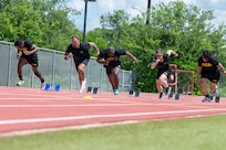 Team Army competitors launch from the starting line during a track training at the 2026 Warrior Games training camp in San Antonio, Texas, June 10, 2026.