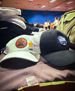 Hat display and paraphernalia represents Team Army pride and participation in the 2026 Warrior Games in San Antonio, Texas, June 13-20, 2026.
