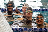 U.S. Army 1st Lt. Jani Merritt (left), Staff Sgt. Chelsey Scott (center), Staff Sgt. Brittany Wolfe (center) and Capt. Channda Mitchell (right), pose for a photo during swimming training for the 2026 Warrior Games in San Antonio, Texas, June 11, 2026.
