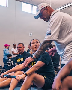 U.S. Army Maj. Patricia Zumwalt receives instruction from Team Army coach, Greg Quarles, during an indoor rowing training session for the 2026 Warrior Games in San Antonio, Texas, June 12, 2026.