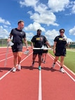Retired U.S. Army Chief Warrant Officer 3 Jonathan Tallman (left), Retired Capt. Tony Smith (center), and Sergeant Tukiau Salanoa-Tuioti, (right), walk with pride as they prepare to participate in track training event for the 2026 Warrior Games in San Antonio, Texas, June 10, 2026.
