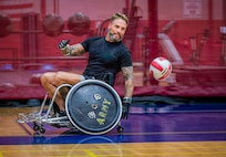 Retired U.S. Army Chief Warrant Officer 3 Jonathan Tallman turns to receive ball as he participates in wheelchair rugby training for the 2026 Warrior Games in San Antonio, Texas, June 10, 2026.