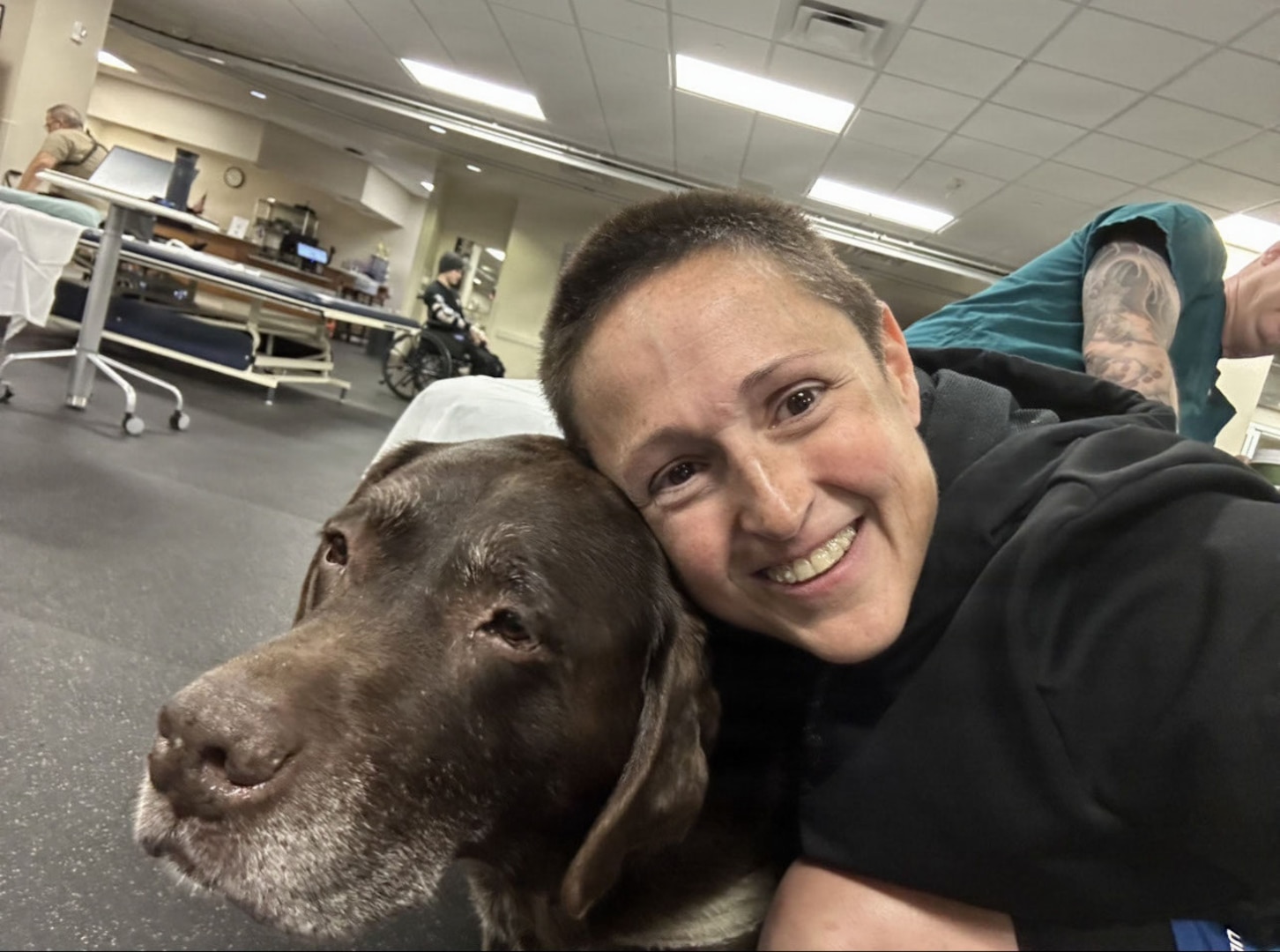 Retired U.S. Public Health Service Commissioned Corps Lt. Cmdr. Michelle Sheedy and facility dog Truman