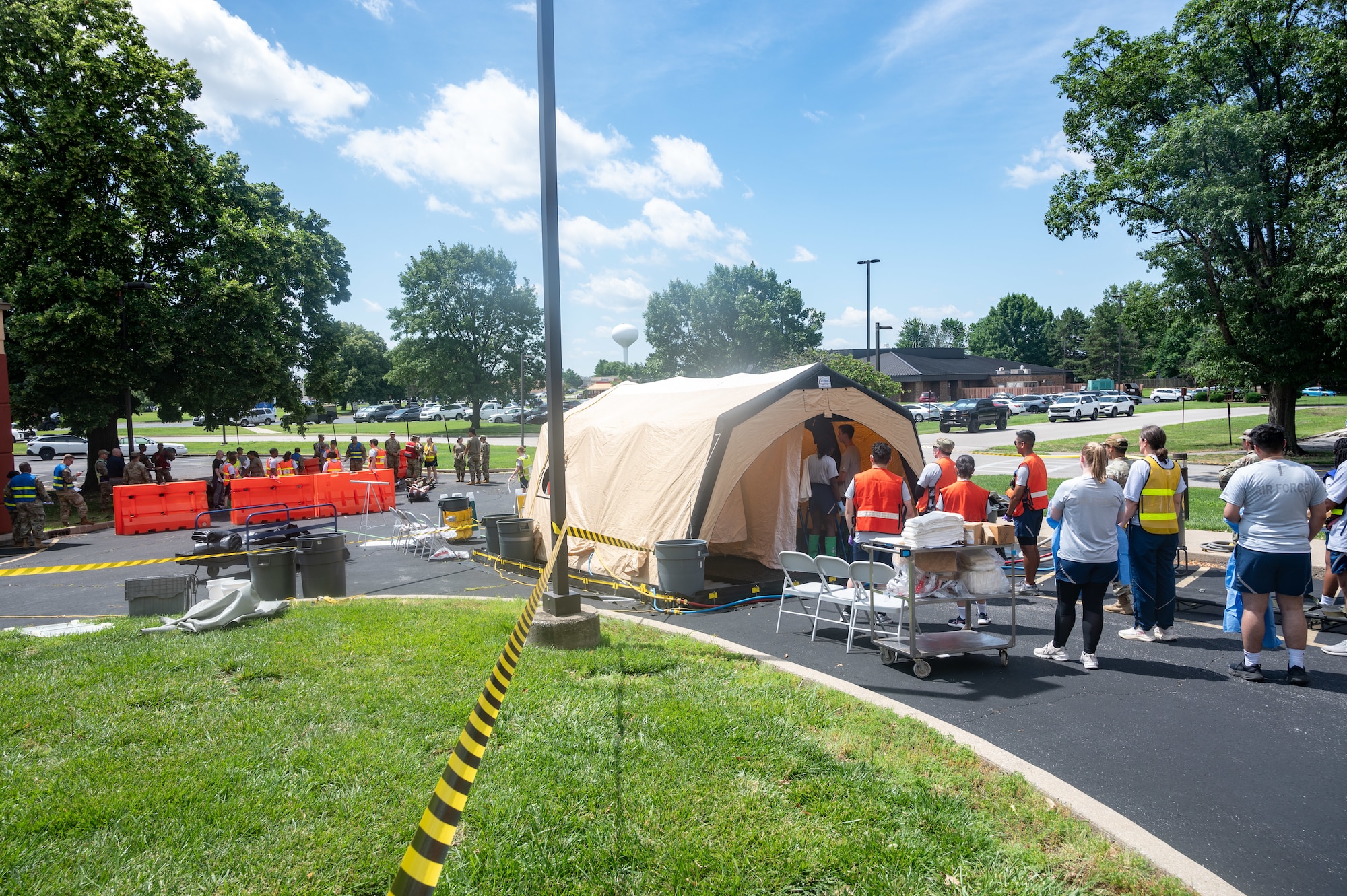 Airmen are decontaminated using tent