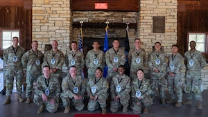 U.S. Air Force Master Sgt. selects gather together for a group photo