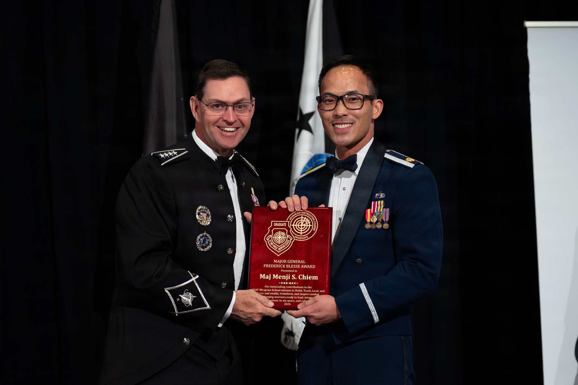 Maj. Menji Chiem receives an award.