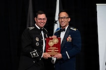 Maj. Menji Chiem receives an award.