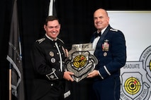 Gen. Chance Saltzman receives a plaque.