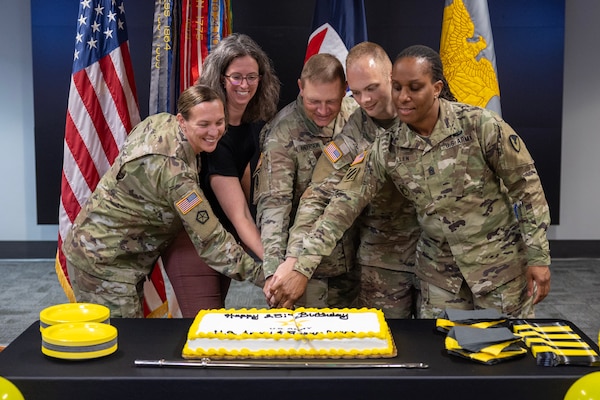 From left to right, Col. Michelle M. Williams, U.S. Army Financial Management Command commander; Denise Gallion, USAFMCOM acting deputy to the commander; Maj. Todd Anderson, USAFMCOM Army Financial Services division chief; 1st Lt. Gunnar Ehlers, 45th Finance Center finance operations officer, cut a cake during a U.S. Army and Army Finance Corps 251st birthday celebration at the Maj. Gen. Emmett J. Bean Federal Center in Indianapolis June 15, 2026. The U.S. Army was established by the Second Continental Congress on June 14, 1775; and just two days later on June 16th, 1775, that same congress established the U.S. Army Finance Corps with creation of the office of Paymaster General, which was first held by James Warren. (U.S. Army photo by Mark R. W. Orders-Woempner)