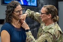 Col. Michelle M. Williams, U.S. Army Financial Management Command commander, presents Karen F. Percinel, USAFMCOM Army Accounting and Audit Operations accountant with a Department of the Army Civilian Service Commendation Medal at the Maj. Gen. Emmett J. Bean Federal Center in Indianapolis June 15, 2026. Percinel was recognized as one of the U.S. Army Materiel Command top employees of the quarter for the Fiscal Year 2026 second quarter. (U.S. Army photo by Mark R. W. Orders-Woempner)
