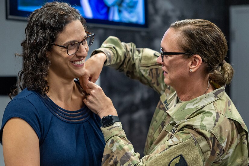 Col. Michelle M. Williams, U.S. Army Financial Management Command commander, presents Karen F. Percinel, USAFMCOM Army Accounting and Audit Operations accountant with a Department of the Army Civilian Service Commendation Medal at the Maj. Gen. Emmett J. Bean Federal Center in Indianapolis June 15, 2026. Percinel was recognized as one of the U.S. Army Materiel Command top employees of the quarter for the Fiscal Year 2026 second quarter. (U.S. Army photo by Mark R. W. Orders-Woempner)