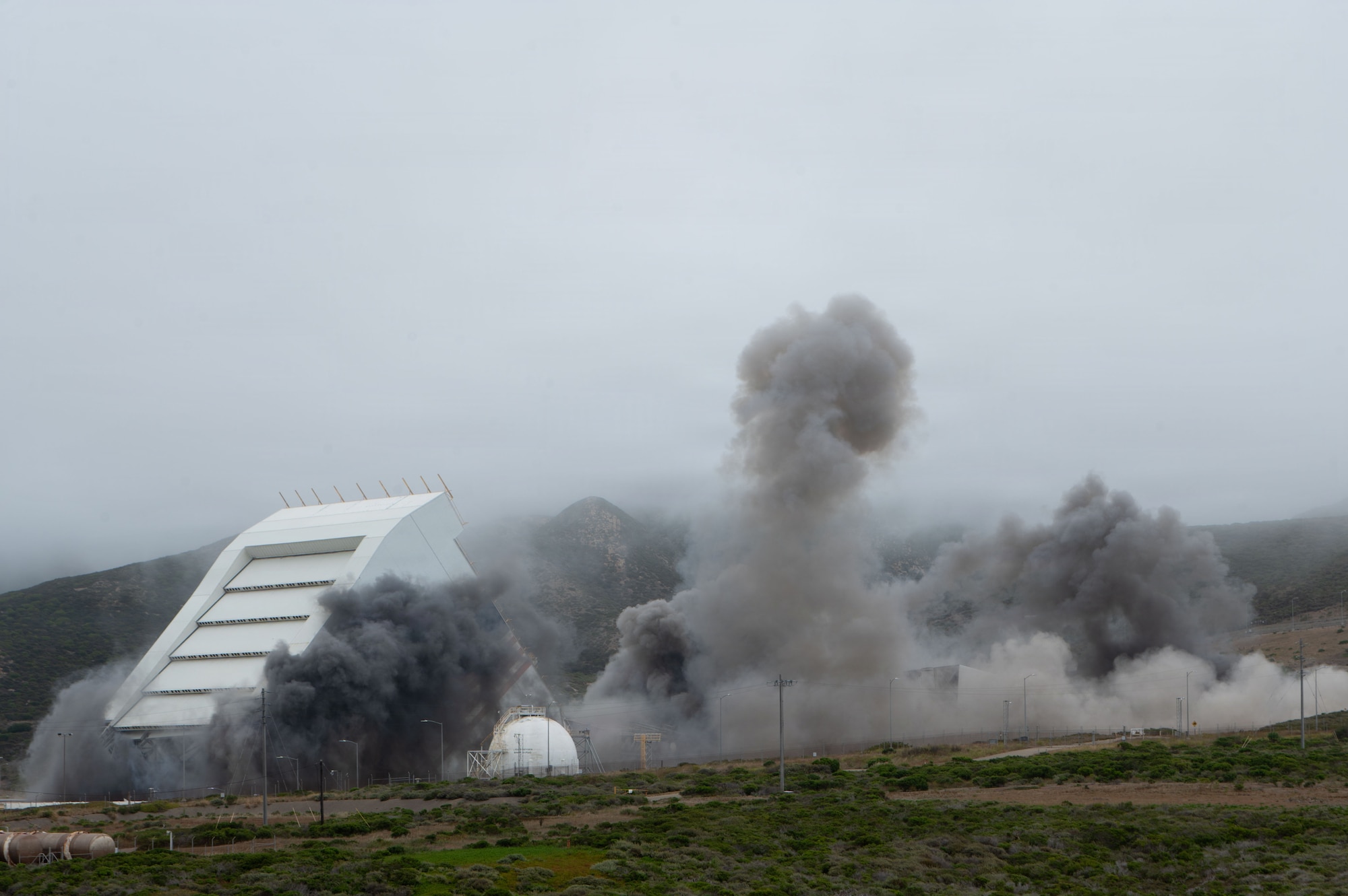 Space Launch Complex 6 collapses during a controlled demolition.