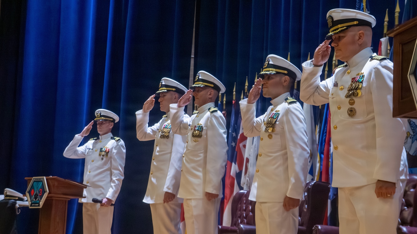 Naval Base Ventura County, Calif. (May 21, 2026) The official party renders honors to the colors during the change of command ceremony for Unmanned Undersea Vehicle Squadron (UUVRON) 3 at Needham Theater at Naval Base Port Hueneme, May 21, 2026. UUVRON 3’s mission is to tactically operate and maintain XLUUVss fleetwide. (U.S. Navy photo by Logistics Specialist 1st Class Paul Villalobos)