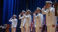 Naval Base Ventura County, Calif. (May 21, 2026) The official party renders honors to the colors during the change of command ceremony for Unmanned Undersea Vehicle Squadron (UUVRON) 3 at Needham Theater at Naval Base Port Hueneme, May 21, 2026. UUVRON 3’s mission is to tactically operate and maintain XLUUVss fleetwide. (U.S. Navy photo by Logistics Specialist 1st Class Paul Villalobos)