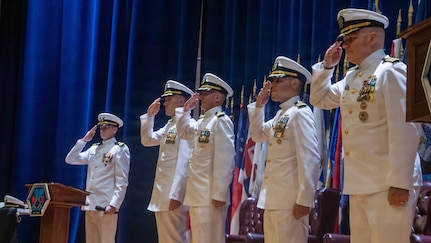 Naval Base Ventura County, Calif. (May 21, 2026) The official party renders honors to the colors during the change of command ceremony for Unmanned Undersea Vehicle Squadron (UUVRON) 3 at Needham Theater at Naval Base Port Hueneme, May 21, 2026. UUVRON 3’s mission is to tactically operate and maintain XLUUVss fleetwide. (U.S. Navy photo by Logistics Specialist 1st Class Paul Villalobos)