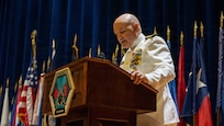 Naval Base Ventura County, Calif. (May 21, 2026) Capt. Aaron Peterson, director of Training, Tactical Development, Ordnance, and Doctrine, for Commander, Submarine Force, U.S. Pacific Fleet, speaks during the change of command ceremony for Unmanned Undersea Vehicle Squadron (UUVRON) 3 at Needham Theater, May 21, 2026. UUVRON 3’s mission is to tactically operate and maintain XLUUVs fleetwide. (U.S. Navy photo by Logistics Specialist 1st Class Paul Villalobos