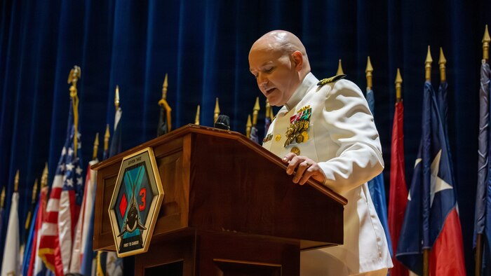 Naval Base Ventura County, Calif. (May 21, 2026) Capt. Aaron Peterson, director of Training, Tactical Development, Ordnance, and Doctrine, for Commander, Submarine Force, U.S. Pacific Fleet, speaks during the change of command ceremony for Unmanned Undersea Vehicle Squadron (UUVRON) 3 at Needham Theater, May 21, 2026. UUVRON 3’s mission is to tactically operate and maintain XLUUVs fleetwide. (U.S. Navy photo by Logistics Specialist 1st Class Paul Villalobos