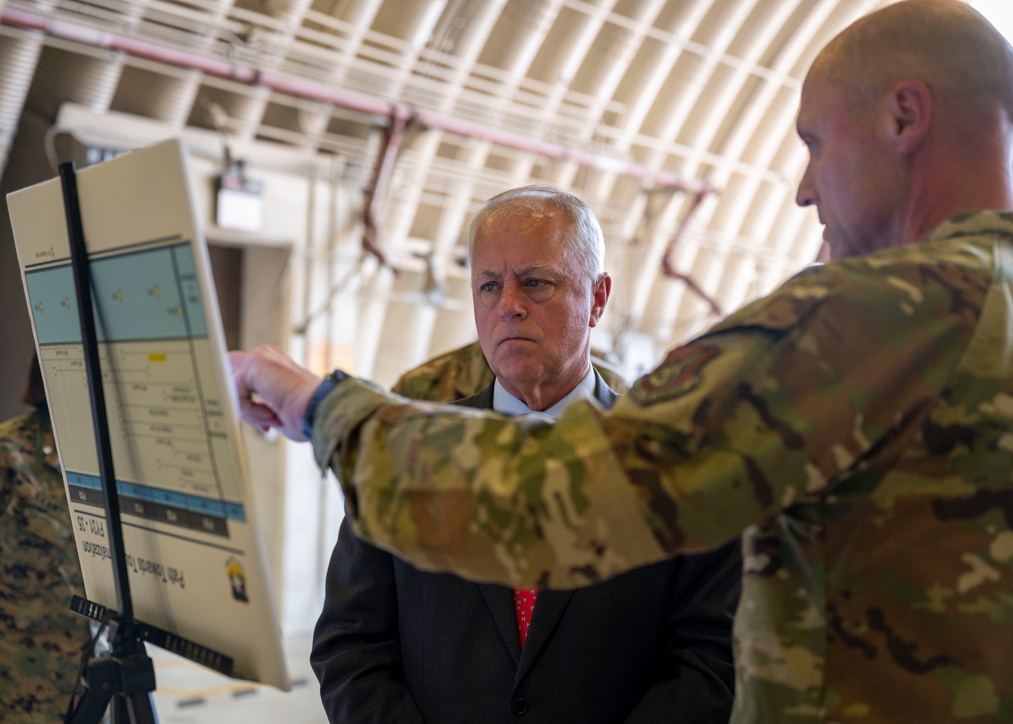 U.S. Air Force Col. Jeff Elliot, 51st Mission Support Group commander, briefs the Under Secretary of War for Personnel and Readiness Anthony J. Tata about command sponsorship numbers during a visit to Osan Air Base, Republic of Korea, May 14, 2026.