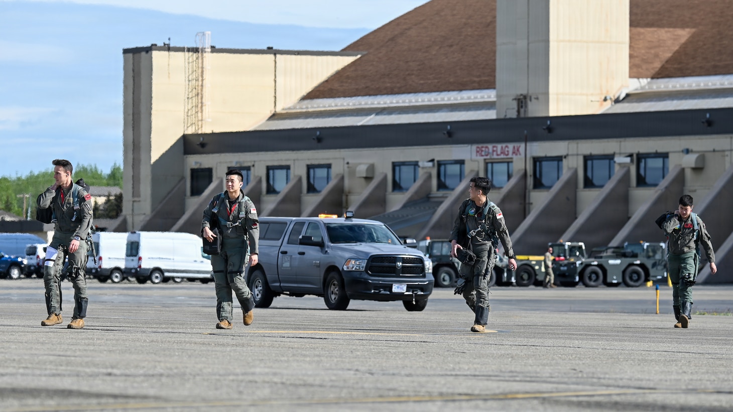 U.S. Air Force and Republic of Singapore F-16 Fighting Falcon pilots assigned to the 425th Fighter Squadron from Luke Air Force Base, Ariz., make their way down the flight line for a RED FLAG-Alaska 26-2 sortie at Eielson Air Force Base, Alaska, June 1, 2026. RF-A 26-2 training spans from individual skills to complex, large-scale joint engagements. Each exercise is a joint and coalition, tactical air combat employment exercise which corresponds to the operational capability of participating units. (U.S. Air Force photo by Tech. Sgt. Kentavist P. Brackin)